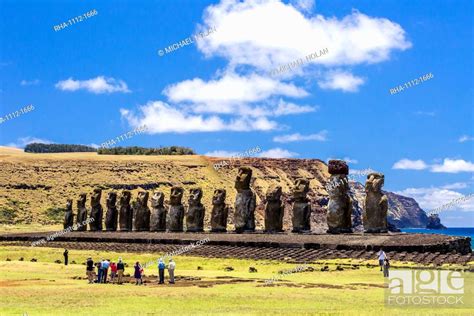 Tourists At The 15 Moai Restored Ceremonial Site Of Ahu Tongariki On