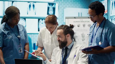 Healthcare professionals examine human anatomy scans to develop