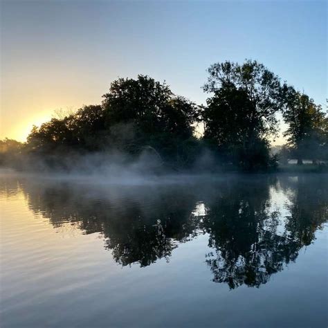 Green Trees Beside Body Of Water During Daytime Sliding Puzzle On