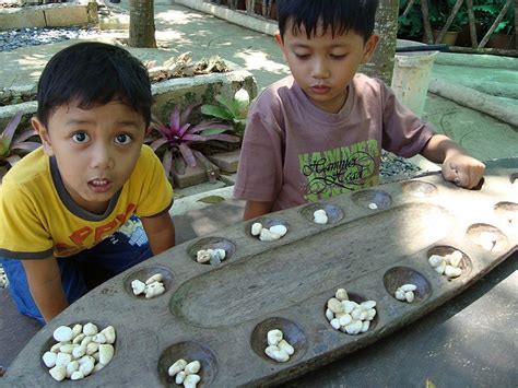 playing sungka | Board games, Dog bowls, Bowl