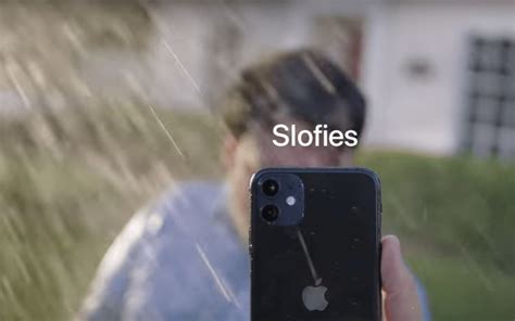 A Man Holding An Iphone In Front Of His Face With The Text Slowies On It