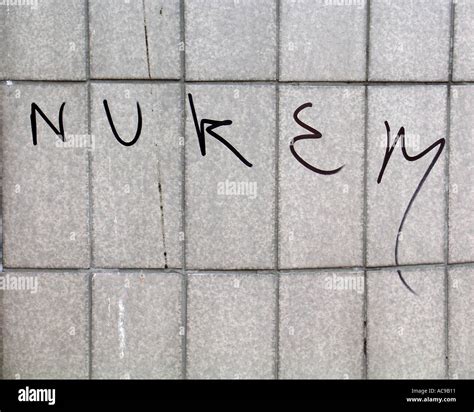 Nukem graffiti on grey wall Stock Photo - Alamy