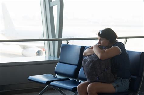 Tired Caucasian Woman In Airport Hall Girl Waiting Her Flight At