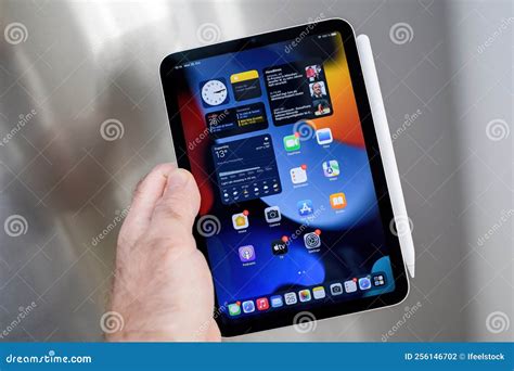 New Apple Ipad Mini Pro Tablet With Pencil Charging On Steel Background