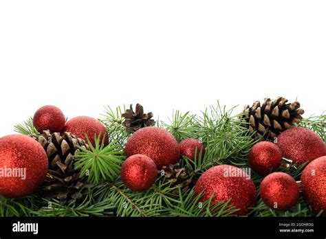 Spruce Branches With Christmas Baubles Isolated On White Background