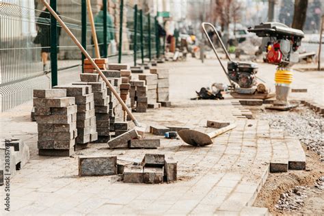 the process of laying paving slabs in the city Stock Photo | Adobe Stock