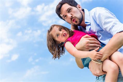 Father Carrying Daughter Protecting Her Stock Photos Free And Royalty