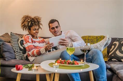 Premium Photo Couple Relaxing Together In Sofa With Tablet Computer