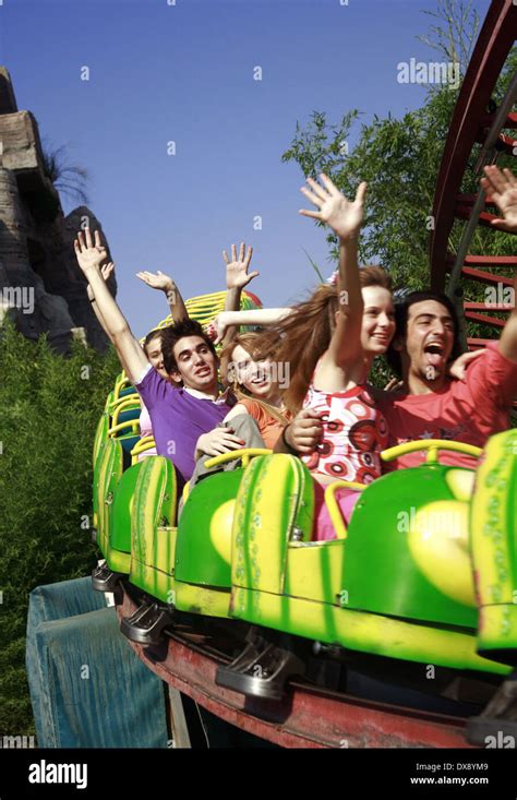 Teenagers on amusement park ride Stock Photo - Alamy