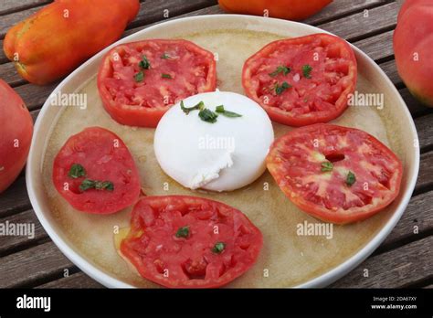 Tomato And Mozarella Salad With Basil Leaf Stock Photo Alamy