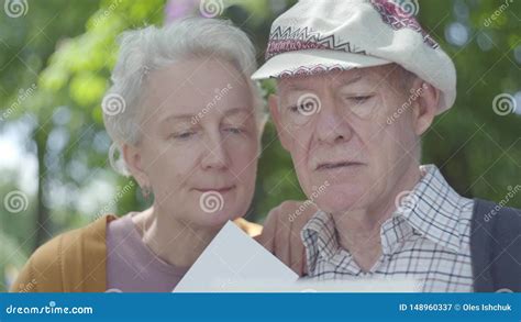 Close Up Portrait Adorable Adult Couple Looking Old Photos Remembering