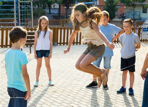 Happy Children Skipping On Jumping Elastic Rope Stock Image Image Of