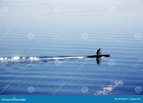 One man with canoe on lake stock image. Image of practicing - 18512917