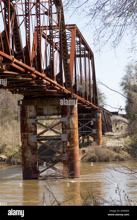 Old rusty steel railroad bridge over the Flint River in Albany Georgia ...