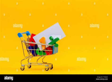 Shopping Cart Or Supermarket Trolley Full Of Colorful Numbers And White