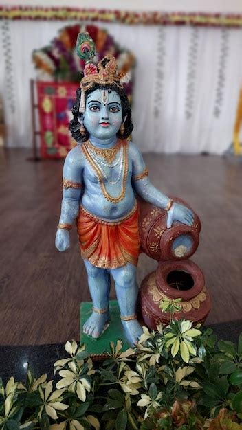 Premium Ai Image Beautiful Statue Of Little Lord Krishna Eating Butter