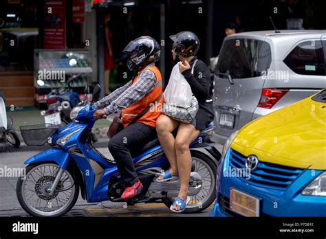 Thailand Motorcycle Taxi And Female Passenger In Traffic Southeast