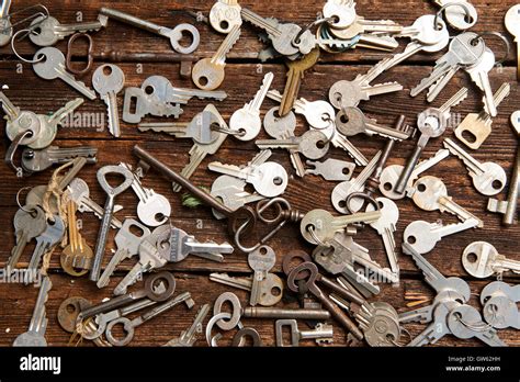 Pile Of Keys On A Grunge Wooden Background Stock Photo Alamy