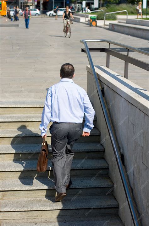 Premium Photo | Businessman go up the stairs