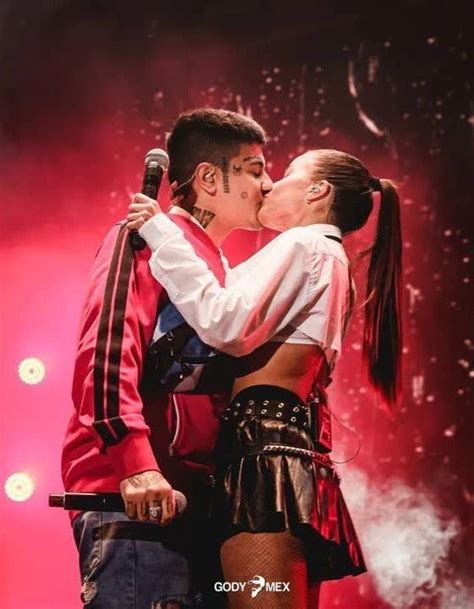 A Man And Woman Are Kissing On Stage