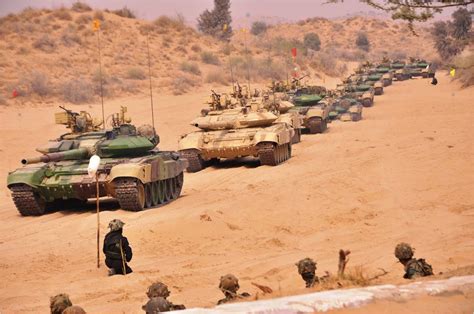 A column of Indian Army T-90 tanks advance during Exercise Akraman II ...