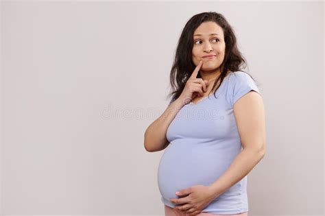 Pensive Multi Ethnic Pregnant Woman Thoughtfully Looking Aside Gently