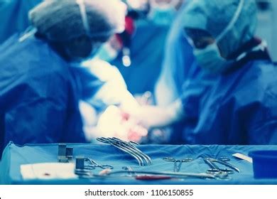 Team Surgeons Operating Wearing Lamp Lighting Stock Photo 1106150855