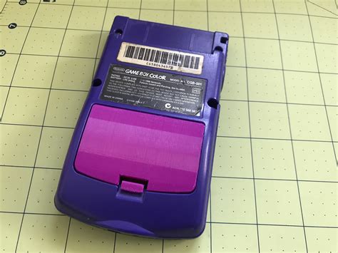 3D Printable Gameboy Color Battery Cover by Rodrigo