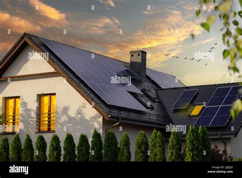 Modern House With Solar Panels Night View Of A Beautiful White House