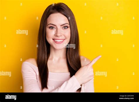 Photo Of Optimistic Brunette Lady Point Empty Space Wear Pink Shirt