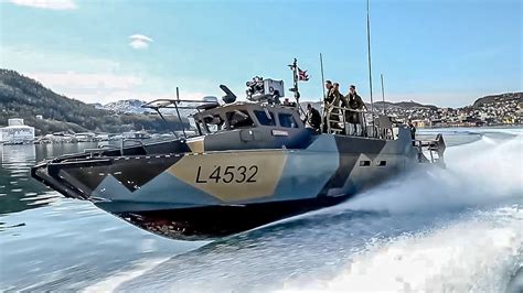 marines fully equipped cb fast military assault craft patrolling