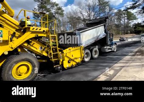 Augusta Ga USA 02 16 22 Road Paving Crew Dump Truck Dumping A Full