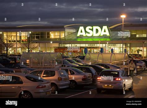 Cars In Asda Supermarket Car Park At Dusk Wales Uk Stock Photo Alamy