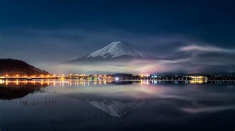 Mount Fuji reflected in Lake Kawaguchi at night (Japan) - backiee