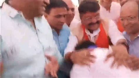 Congress Mla Touches Bjp Candidate Kailash Vijayvargiyas Feet In Poll