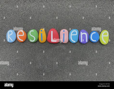 Resilience Word Composed With Multi Colored Stone Letters Over Black