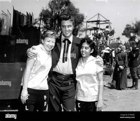 Elvis Presley Poses With Two Young Female Fans On Set Candid During