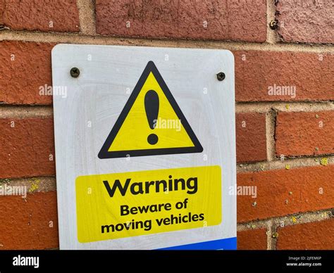 Warning sign for moving vehicles Stock Photo - Alamy