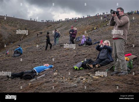 Tourists photographing the eruption of the Geldingadalir Volcano ...