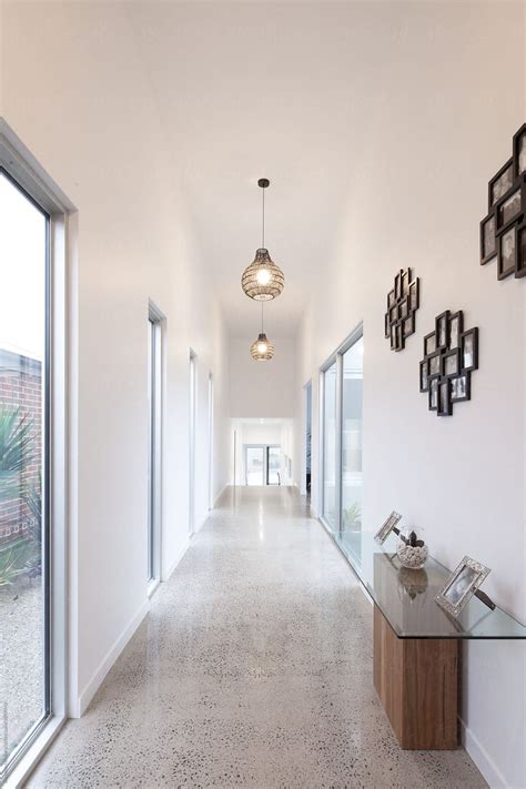 Wide Hallway In Contemporary Home With Polished Concrete Flooring By