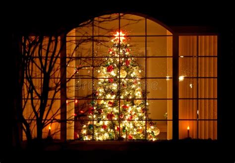 Welcome Home Christmas Tree in Window Stock Photo - Image of ornaments ...