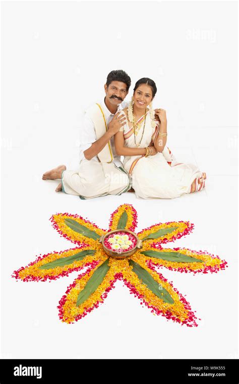 Indian Couple Making Rangoli Cut Out Stock Images And Pictures Alamy