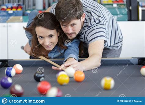 Woman Receiving Advice On Shooting Pool Ball While Playing Billiards Stock Image Image Of