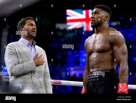 Anthony Joshua Right And Boxing Promoter Eddie Hearn During The National Anthem Prior To The