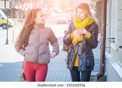 Back View Two Friends Walking Together Stock Photo