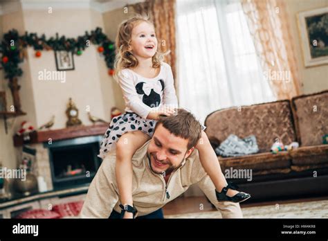 Happy Little Girl Sitting On Dads Neck Stock Photo Alamy