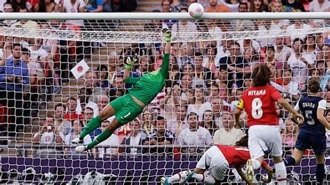 A Soccer Goalie Dives To Catch The Ball