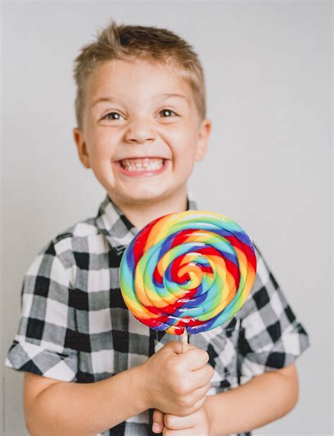 Super Excited Boy Gets A Sweet Treat Del Colaborador De Stocksy Cwp