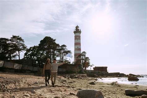 Silhouette of a Couple Holding Hands at a Beach · Free Stock Photo