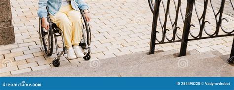 Brunette Woman Sitting In Wheelchair By Stairs Stock Photo Image Of